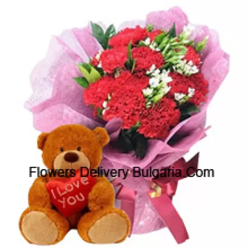 Bunch Of 11 Red Carnations With Seasonal Fillers Along With A Cute 12 Inches Tall Brown Teddy Bear